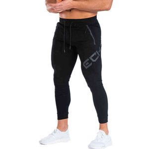 Calça masculina Autumn Winter Brand Gym calça apertada Fitness Casual Elastic Fodybuilding Roupes Novos jogadores de suor casual M-xxl T220909