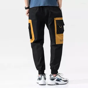 Calça masculina moda de rua de moda grandes bolsos sólidos jogadores de retalhos homens militares solteiras calças hip hop para