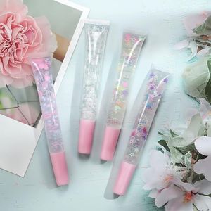 Lipgloss, natürliche Pailletten, transparenter Schlauch, feines Astöl, langanhaltendes, nährendes Serum, Pflege, Private Label, individuelles Massen-Make-up