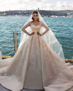 Suknie ślubne Vestidos De Novia suknie ślubne przezroczysta szyja z długim rękawem błyszczące frezowanie cekinami Appliqued arabskie szaty De Mariee