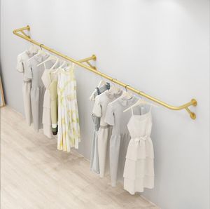 Clothing store display rack Bedroom Furniture Wall mounted shelf in men's and women's cloths shop Gold front side mounted clothes shelfs children's cloth stores