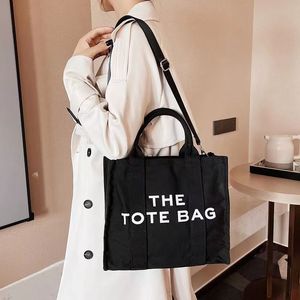 La tote bag lady famoso designer cool pratico Borse moda semplici di grande capacità borse a tracolla donna grande portamonete crossbody casual portafogli quadrati di tela