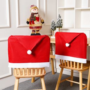 クリスマスの不織布椅子カバーサンタクロースハットダイニングチェアスリップカバークリスマスレッドチェアバック装飾