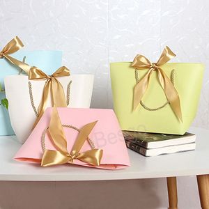 Borsa tote Bowknot Sacchetti regalo in carta tinta unita Vestiti Scarpe Gioielli Borsa per la spesa Regali per le feste Custodia avvolgente Logo personalizzabile BH7607 TYJ