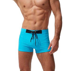 Herrbadkläder 2021 Nya herrboxare Badkläder Shorts Solid färg Låg midja strandkläder australiensiska mode sexiga baddräkt sommar spa strand surf sport j220913