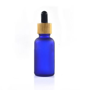Bottiglie di olio essenziale di siero di vetro blu verde ambra trasparente satinato da 30 ml con pipetta contagocce e tappo di bambù