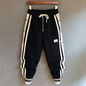 Pantaloni da uomo Moda coreana stampata Hip Hop Pantaloni elastici in vita Pantaloni da uomo Smile Pantaloni da jogging Streetwear Harem Pantaloni con risvolto alla caviglia 220922