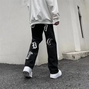 Jeans masculinos estilo vibe nota musical bordado preto streetwear homens calças finas tornozelo zíper hip hop mulheres denim calças pantalon 220930