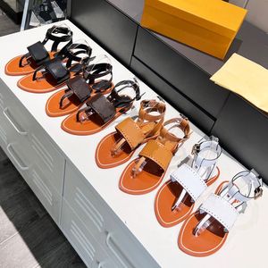 HORIZON FLAT SANDALS Crafted from soft calfskin Delicate style Wide front shoulder strap with delicate perforations Reproducing the brands initials and pattern