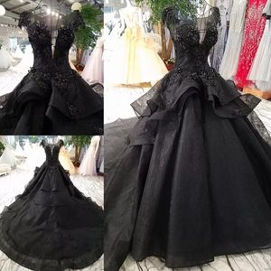 Gothic Black Lace Rüschen Puffy Brautkleid Applikationen Perlen Üppiger schiere Hals Braut Ballkleider Vestidos De Novia