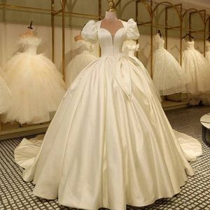 Skromne suknie balowe suknie ślubne ukochane szyję szyi krótki puszysty rękawy satynowy pasek kryształowy zamiatanie pociągu ślubne suknie ślubne