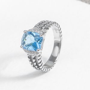 Klassische Frauen Ring eingelegt blau Topaz Farb Zirkon Retro Twisted Kabelringe