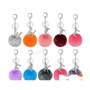 Schl￼sselringe 26 Farben Faux 8 cm Kaninchenfell Pom Poms Ball Key Kette Strass Diamant Alphabet Buchstabe Keyring Handbeutel Auto -Charm Dhchh Dhchh