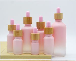 Flacone contagocce in vetro smerigliato Pipetta a goccia Colore rosa con tappo in bambù Bottiglia di olio essenziale da 1 oz 5 ml 10 ml 20 ml 30 ml 50 ml 100 ml Confezione