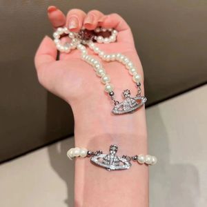Beroemde Britse ontwerper Pearl Pendant Saturn Ketting Bracelet Stereoscopische 3D Planet Collarbone Choker Kettingen Armbanden Sieraden voor vrouwenheren tennisketen