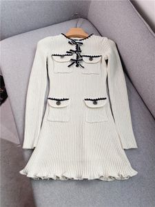 2023 Spring Black / Ivory Ribbon Tie Bowknot Knitted Dress Contrast Color Long Sleeve Round Neck Weave Double Pockets Short Casual Dresses W2D080832