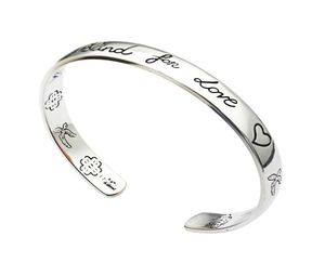 Wholebrand fashion woman charm bracelet G letter engraved LOVE bird heartshaped opening bracelet Ajin version of the couple2489637