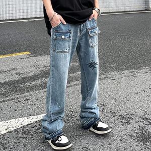 Jeans de moda de moda masculina Bolsões frontais buracos rasgados de rua pintados calças casuais para homens homens harajuku calças largas retas