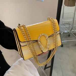 Factory whole women chain bag simple atmospheric pressure flower leather handbag street Stone grain shoulder bags Candy-colore261f