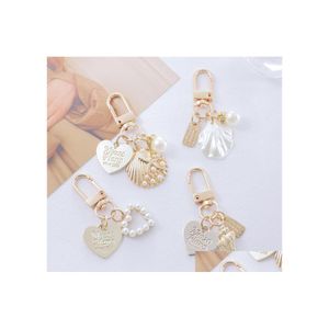 Keychains Lanyards Love Letter Shell Conch Pearl Keychain Girl Bag Hanging Charm Car Keyring Gift For Lover Trinket Drop Delivery Dhiqq