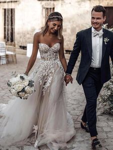 Classico Boho Tulle Abiti da sposa a-line Abiti da sposa lunghi da spiaggia Senza maniche Collo a cuore Appliquato in pizzo Boning esposto Corsetto Sposa Vestido De Novia