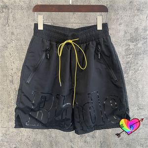 2023 schwarze Shorts für Herren und Damen, 1-Reißverschluss-Shorts, gelber Kordelzug, große grafische Mesh-Nylon-Reithose