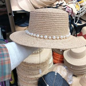 Breda randen hattar franska elegant pärla kedja lyx raffia platt topp halm för kvinnor handgjorda lady sommar strand mössa sol visir