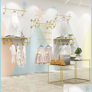 Mobili commerciali Espositore per negozi di abbigliamento per bambini Mobili commerciali Oro per bambini Negozio di tessuti Scaffale da parete Appendiabiti Hang Dhjka