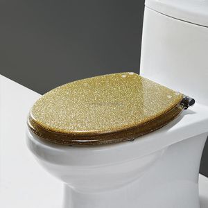 يغطي مقعد المرحاض غطاء راتينج ذهبي جميل ذو جودة عالية يتباطأ مفصليًا من الفولاذ المقاوم للصدأ U/V/O Universal
