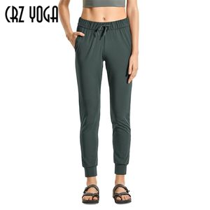 CRZ YOGA Women's Casual Travel Lounge Pants Stretch Drawstring Jogger Fitted Cuffed Sweatpants with Pockets 28 inches302D