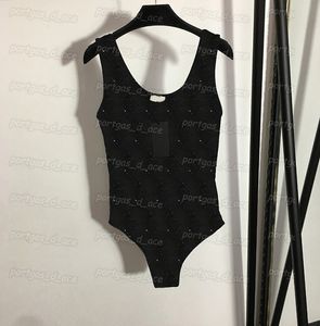 ラインストーンの女性Tシャツセクシーなシールメッシュプレイスーツのノースリーブブラックボディスーツ