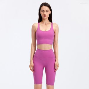 Set attivi Set da yoga di alta qualità Pantaloncini sportivi a vita alta Reggiseno da fitness incrociato sexy da donna Tuta aderente da palestra Tuta da ginnastica da donna