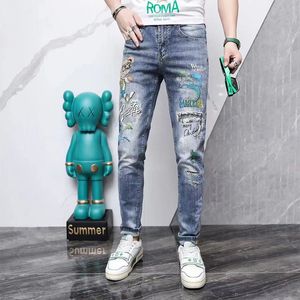 Men's Jeans Slim Fit Small Feet Light Blue Cartoon Print Fashion Brand Four Season Pencil Pants Young Streetwear Male Trousers Men's Clothing