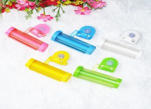Whole 5 Colors Plastic Rolling Tube Squeezer Useful Toothpaste Easy Dispenser Bathroom Toothpaste Holder Bathroom Accessori4779157