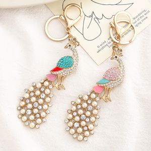 Creative Diamond Set Pearl Peacock Keychain Pendant Lega di moda Portachiavi simpatico cartone animato per borse Appendere gioielli Accessori regalo