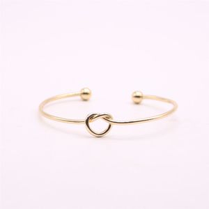 2022 new Fashion lovely knotted bangles iron alloy electroplated gold bangle for women wholesale top quality