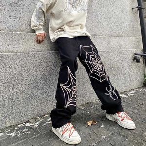 Jeans de jeans masculinos American High Street Hip Hop Men solto calças de perna larga e reta Design Spider Web Print Denim Troushers T2221102