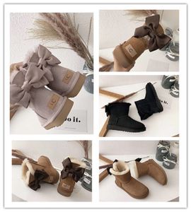 2023 Catwalk Style Boots Boots Fashions Big Bowknot Design Bootes للنساء العلامة التجارية الفاخرة Ugglie Winter Warm Shoes Wggs Woolen Boots