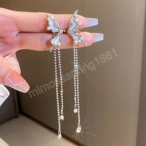 Orecchini a clip a farfalla color argento intarsiato con strass lungo orecchino con nappa polsini con perla simulata per gioielli di moda da donna