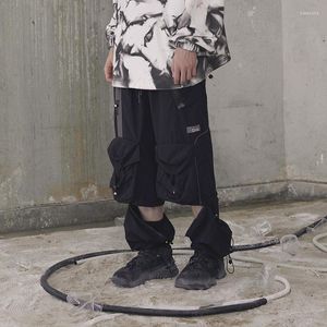 Męskie spodnie Mężczyźni swobodny patchwork ładunek hip hop elastyczne kombinezony męskie spodnie streetwearu Pocks Techwear Lose zamki błyskawiczne Zdejmowane czarne