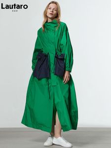 女性はラウターロ春秋の秋の大きなポケットを持つ女性のためのロングの長い特大の緑のトレンチコートを描きました豪華なデザイナーファッション221124
