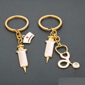 Chave an￩is de metal enfermeira injetor Ech￴metro Charme Teclado anel de ouro Hangbag Hang Hanges Jewelry Drop Delivery Dh2jq
