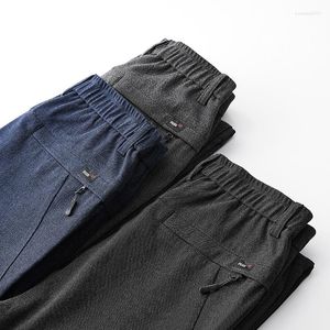 Męskie spodnie Wysokiej jakości jesienna zima szczotkowana tkanina Mężczyźni Slim Grube Busint Pant Zip Pocket Stretch Modna moda