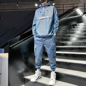 Tute da uomo Tuta autunnale e invernale da uomo Abbigliamento casual in due pezzi Giacca riflettente da notte luminosa con cappuccio Sport all'aria aperta