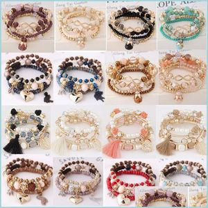 Braccialetti Charm 20pcs/Lotto all'ingrosso Mtilayer Stretch Stackable Bracciale Bracciale Braccialette di perline bohémien per donne ragazze mti lulubaby dhkdh