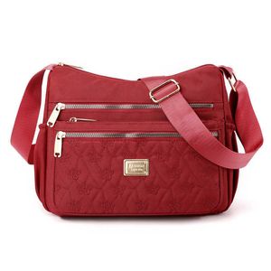 HBP 2023 nova bolsa feminina de meia-idade bolsa feminina Nylon Oxford bolsa de lona giratória é bolsa mensageiro de ombro único à prova d'água bolsa da mãe