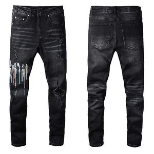 Zwarte skinny jeans stretch voor heren fietser slanke knie gescheurd met gatspray op letter verf man pant splash ontwerper verontruste motor fit