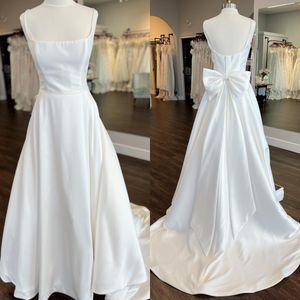 A-Line Bridal Wedding Dress 2023 with Bow Pockets Satin vestidos de novia Chapel Train Garden Castle Beach robe de mariee Square Neckline Spaghetti Straps Scoop Back