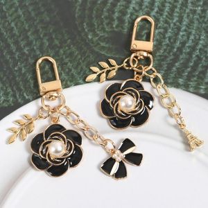 Keychains Camellia Schwarzer Bogen Schlüsselbund Pearl Mode Schmuck Anhänger Luxus Blumenauto-Tasche Schlüssel Ring Anti-verlorene Geschenkzubehör Großhandel Großhandel