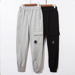 Calças masculinas High Street Tide Marca Mens Tech Fleece Bolso Lente Terry Tecido Sweatpants Homens e Mulheres Casal Calças Básicas CP